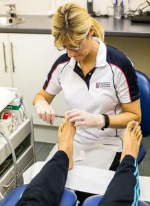 Judith Cowling Podiatrist treating a patient with nail problems at Foot Talk Podiatry