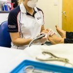 Judith Cowling treating a patient at Foot Talk Podiatry Clinic